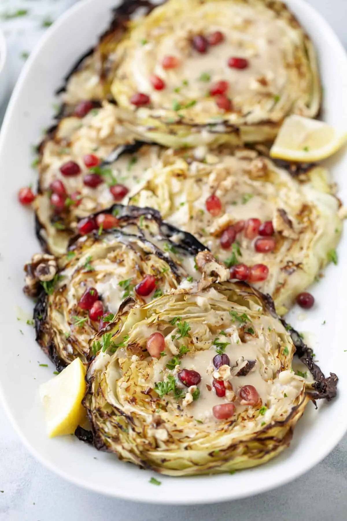 Blistered Cabbage Steaks with Maple Tahini & Pomegranate