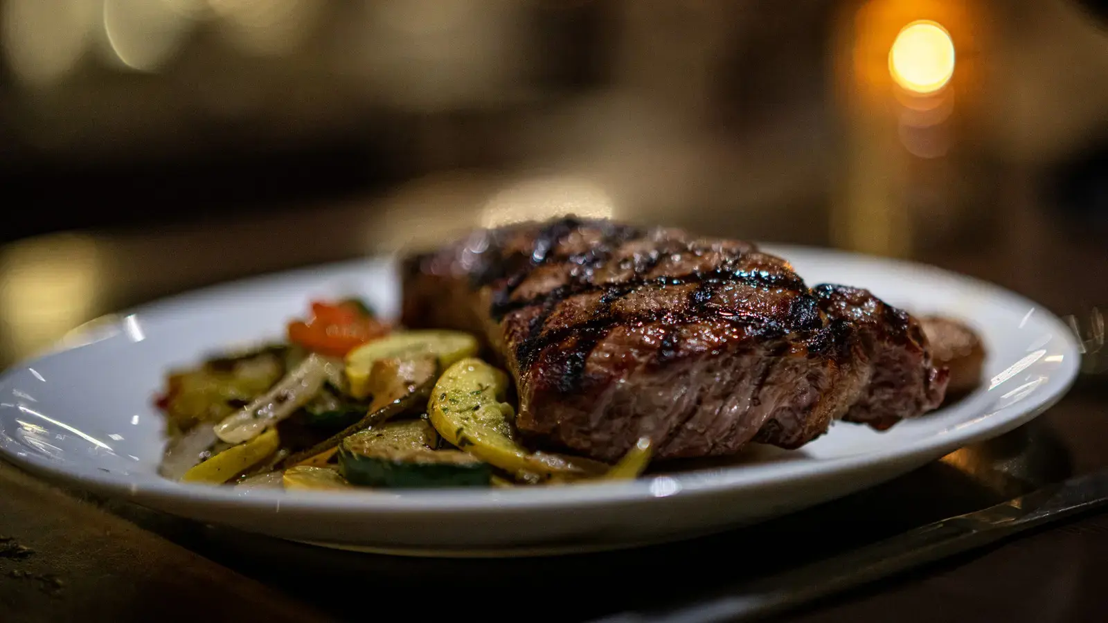 The Tiny Canned Ingredient That Doubles As A Flavor-Packed Steak Marinade