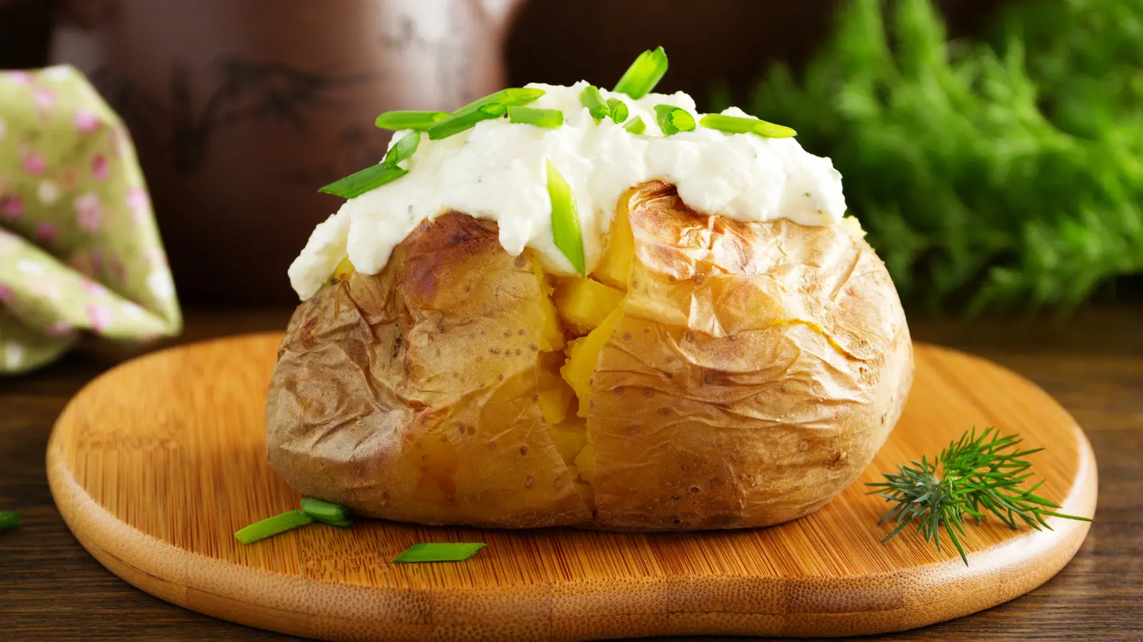 The Best Topping For Baked Potatoes Isn't Butter Or Sour Cream