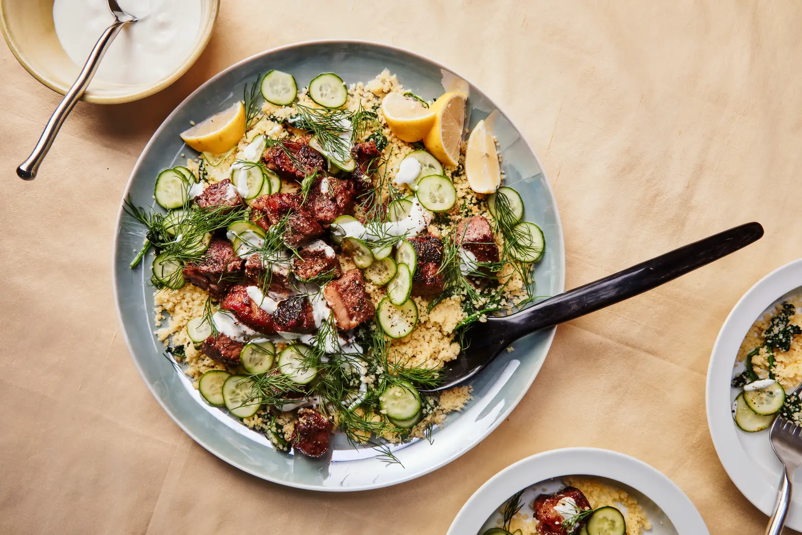 Garlic Steak Bites Served Over Savory Spinach Couscous