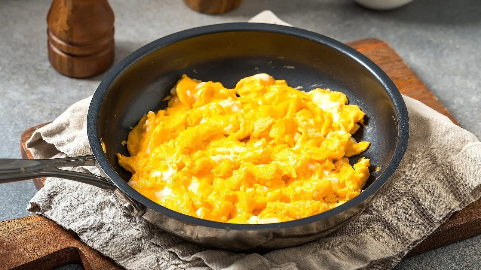 Scrambled Eggs Get A Tangy Flavor Boost When You Add This Shredded Veggie